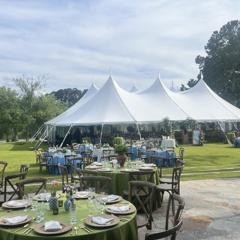 Sailcloth tent with lakeside reception setup